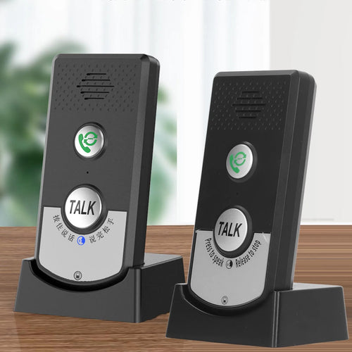 Black two-way wireless intercom doorbell units on charging stands with TALK button