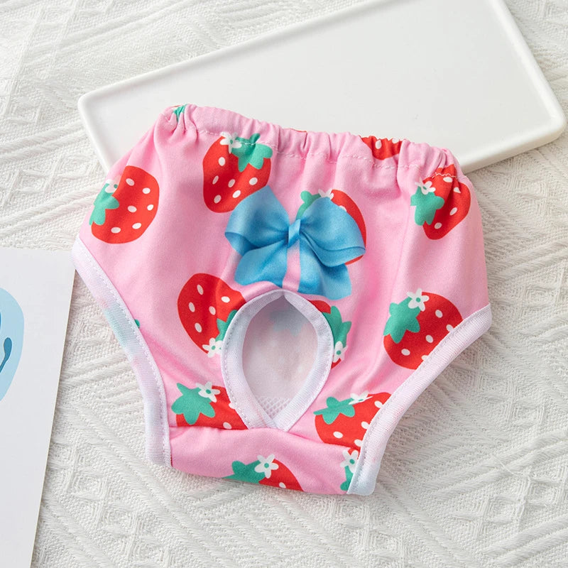 Washable pink strawberry print dog diaper for female pets. Reusable sanitary panties with blue bow for small dogs/cats.