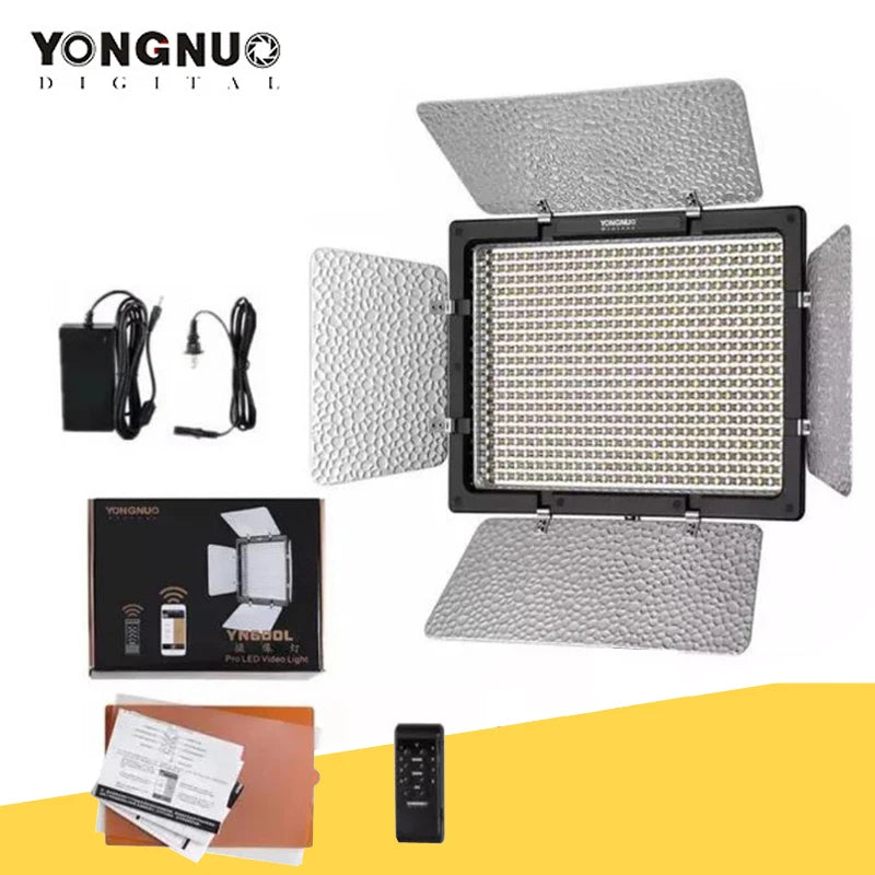 LED video light panel with four reflective metal barn doors, power adapter, remote control, box, and manual.