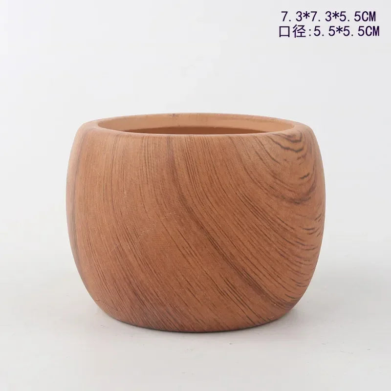 Ceramic succulent pot with warm wooden-brown finish and rounded, faceted sides