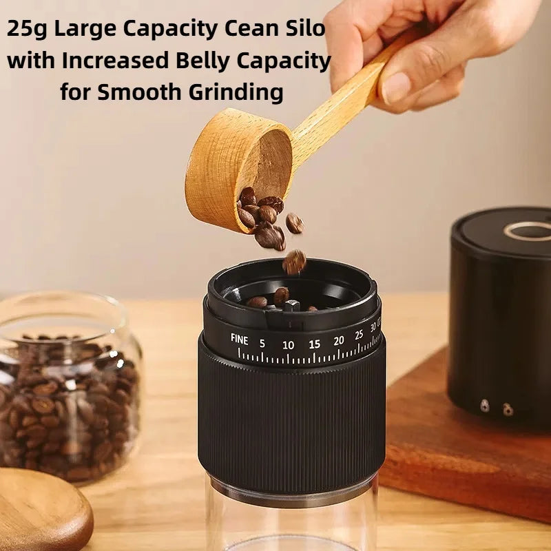 Hand pouring coffee beans into a black 25g capacity manual coffee grinder with adjustable grind settings.