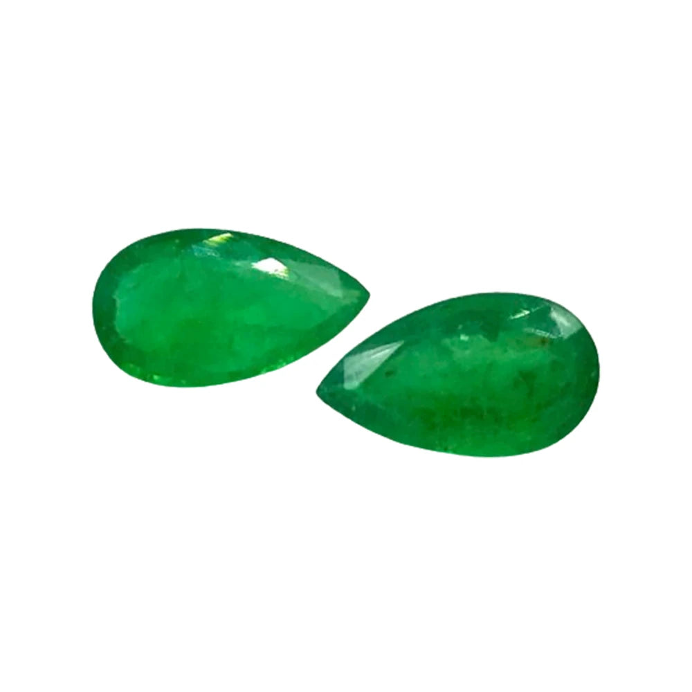 Pair of green teardrop gemstone cabochons with glossy surface