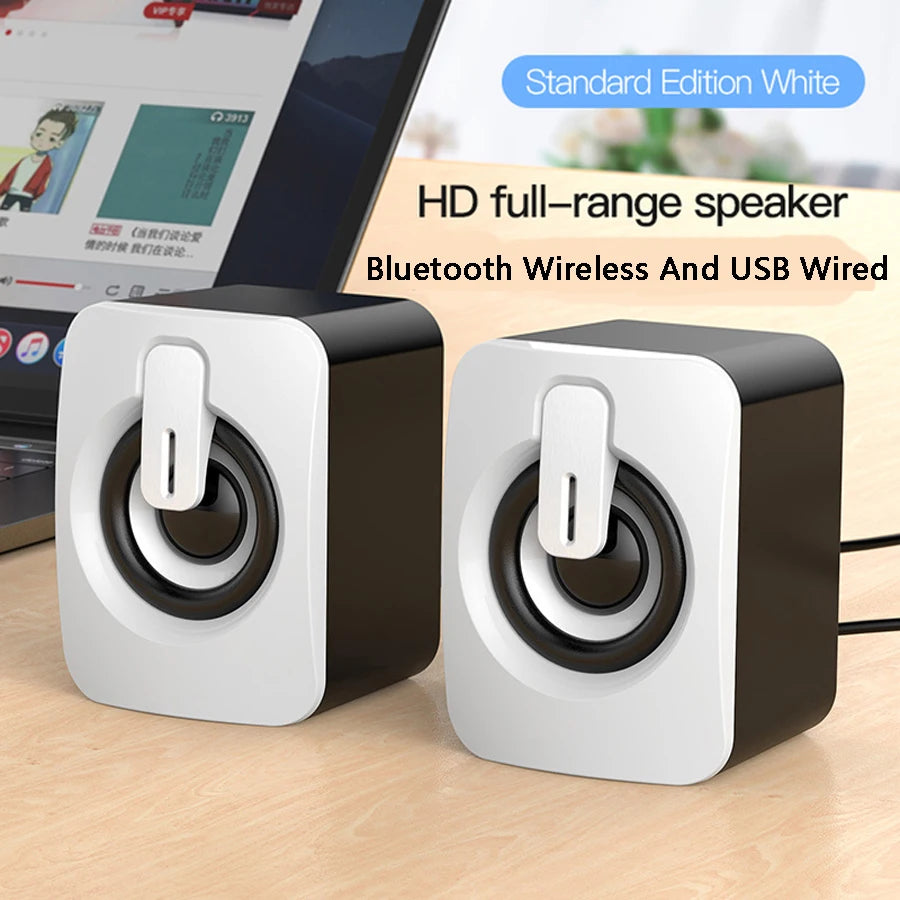 White mini desktop speaker pair with black circular drivers and top USB ports