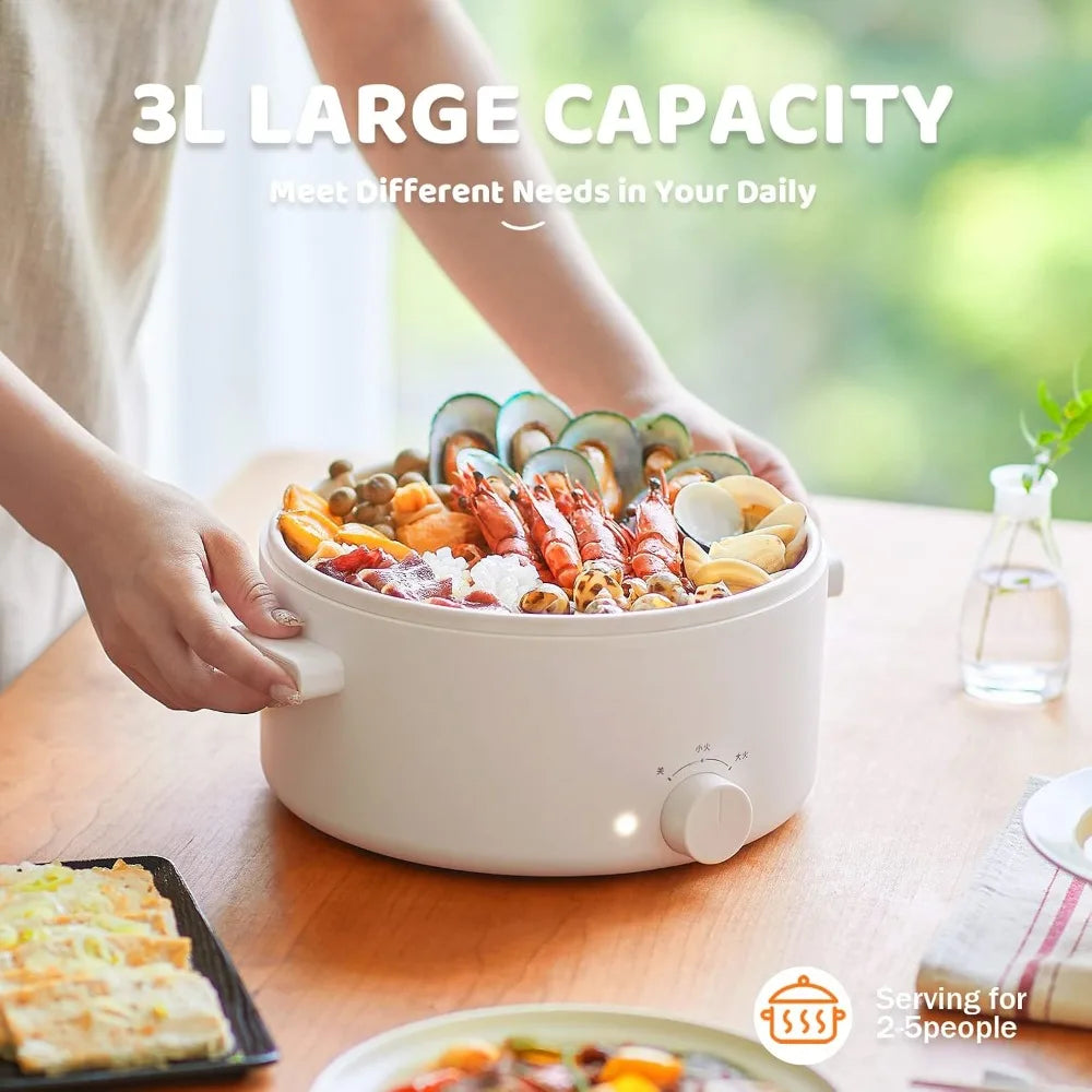 3L electric hot pot with open lid holding mixed ingredients on a dining table
