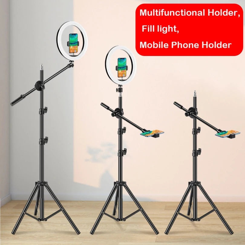 Three black adjustable tripod stands with circular LED fill lights and phone holders for recording or photography.