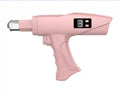 Pink handheld beauty device with a pistol-grip shape, digital display, and a clear nozzle attachment.