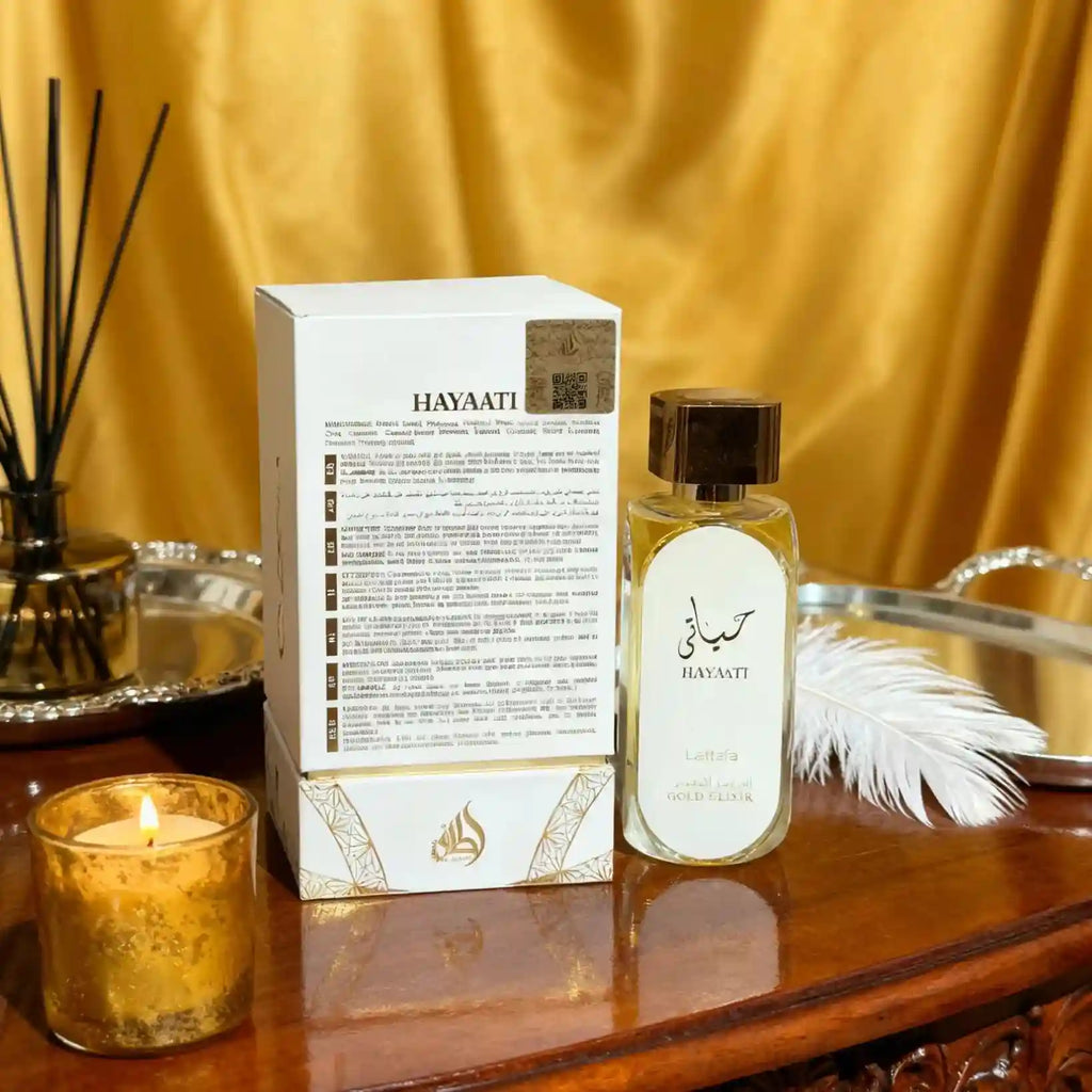 Lattafa Hayaati Gold Elixir men’s EDP: long-lasting Arabic aromatic scent in a sleek cylindrical glass bottle.