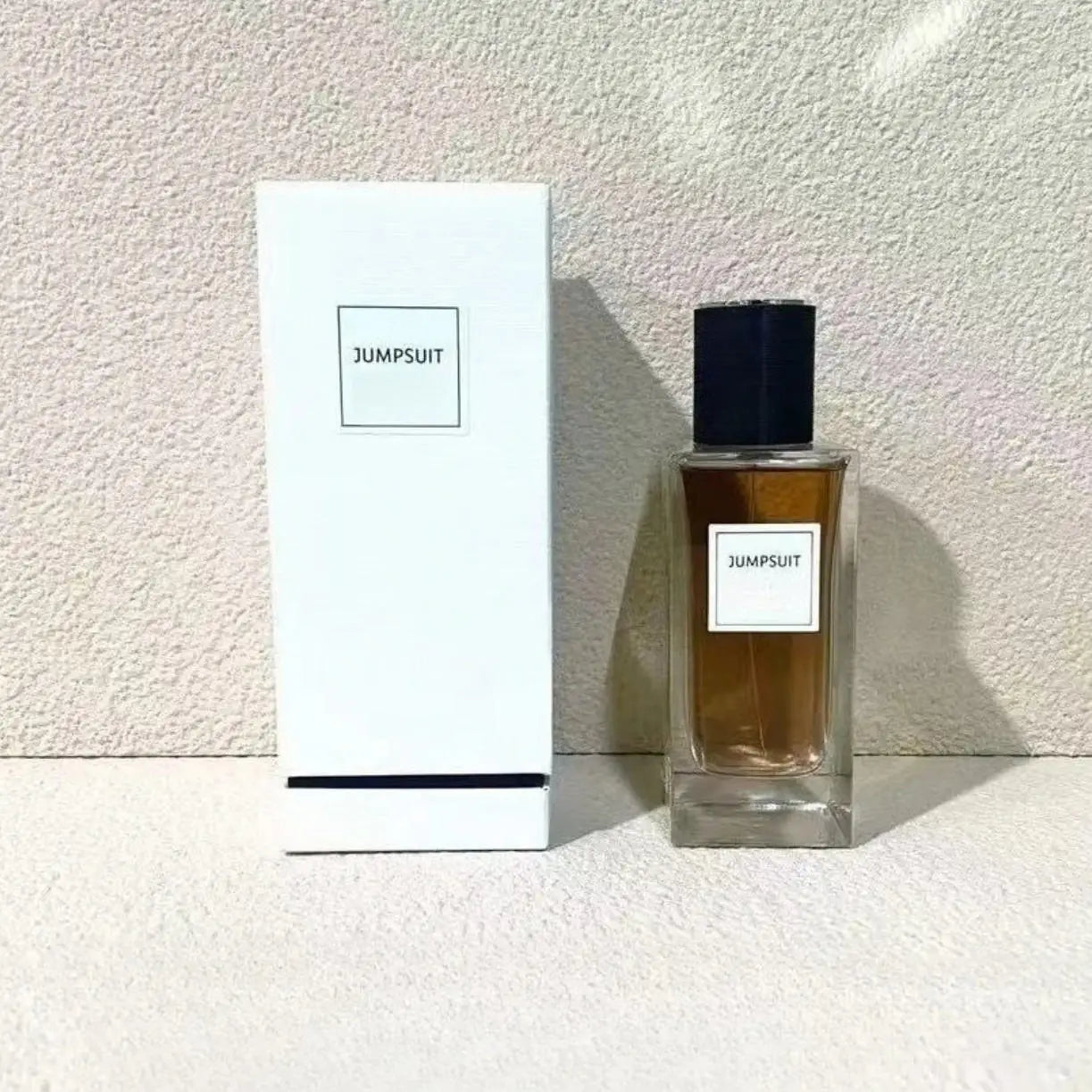 Jumpsuit 125ml unisex oriental woody floral perfume. Rectangular glass bottle, long-lasting grapefruit scent.