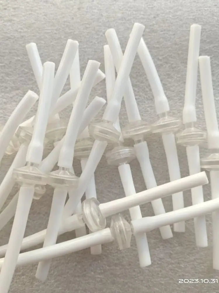 White disposable connection tubes for Microneedle RF cartridge machines, used for skin lifting and scar treatments.
