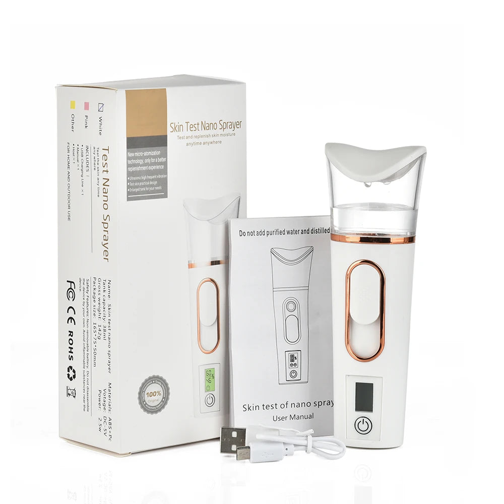 Portable white and rose gold nano facial sprayer and skin moisture tester with USB charging cable and product box.