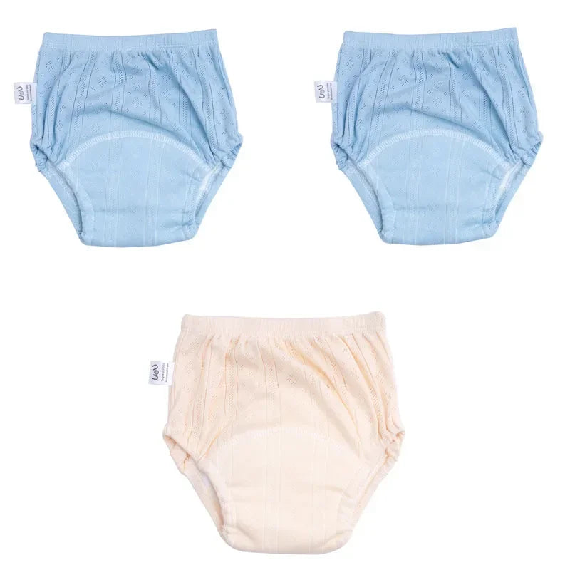Set of 3 Uou baby training diaper pants in blue and cream with soft, absorbent fabric for potty training.