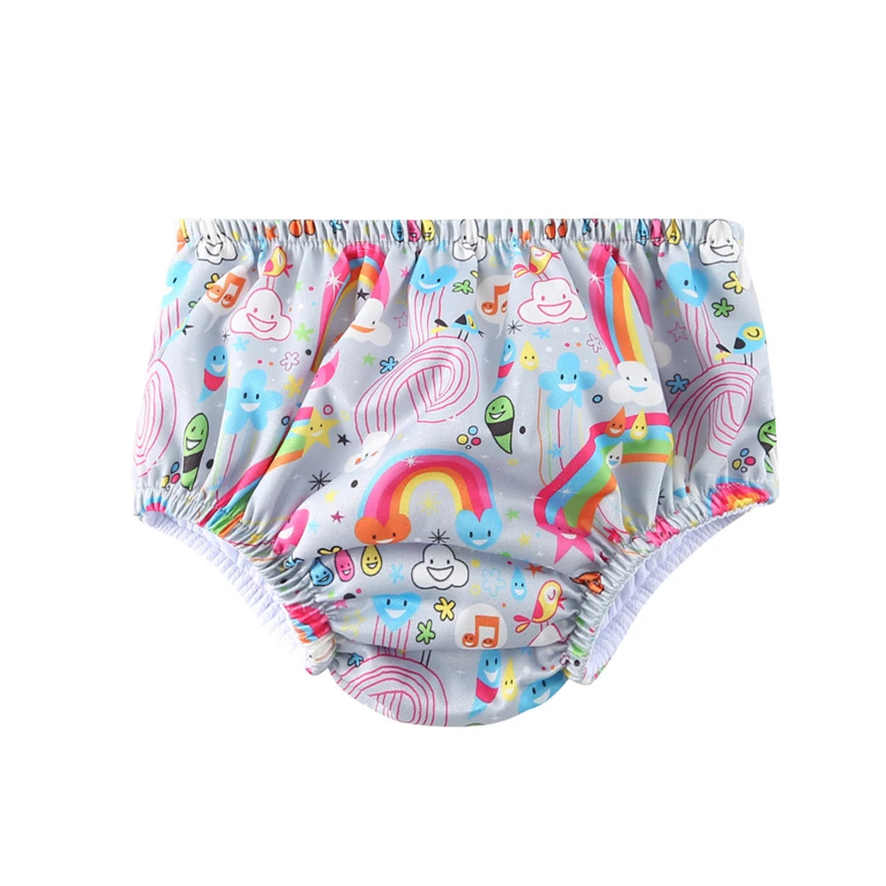 Reusable cloth swim diaper with colorful rainbow and happy cloud print for babies.