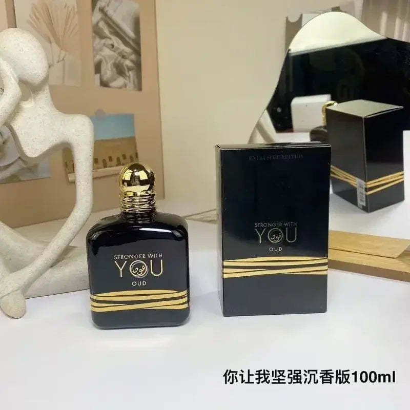 Stronger With You Oud 100ml: Unisex EDP perfume, black bottle with gold accents. Long-lasting woody fragrance spray.