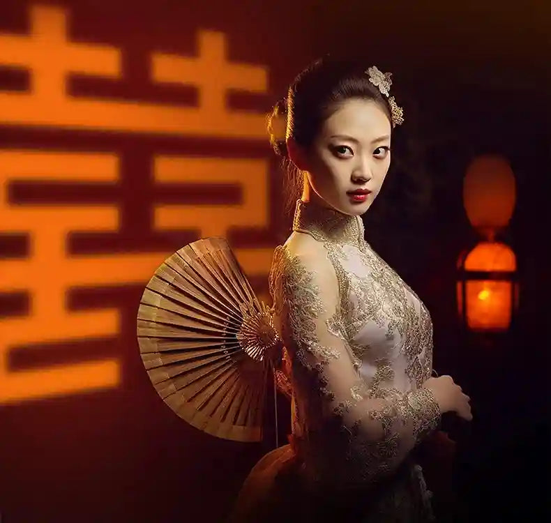 Round wooden hand fan with slats, used as a traditional wedding accessory for formal attire.