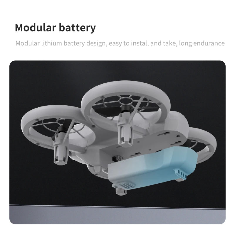 Small white drone with a rectangular light blue modular battery pack attached to the base.
