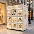 Foodline flower vending machine on wheels with glass doors showcasing lit bouquets and pink rose side panels.