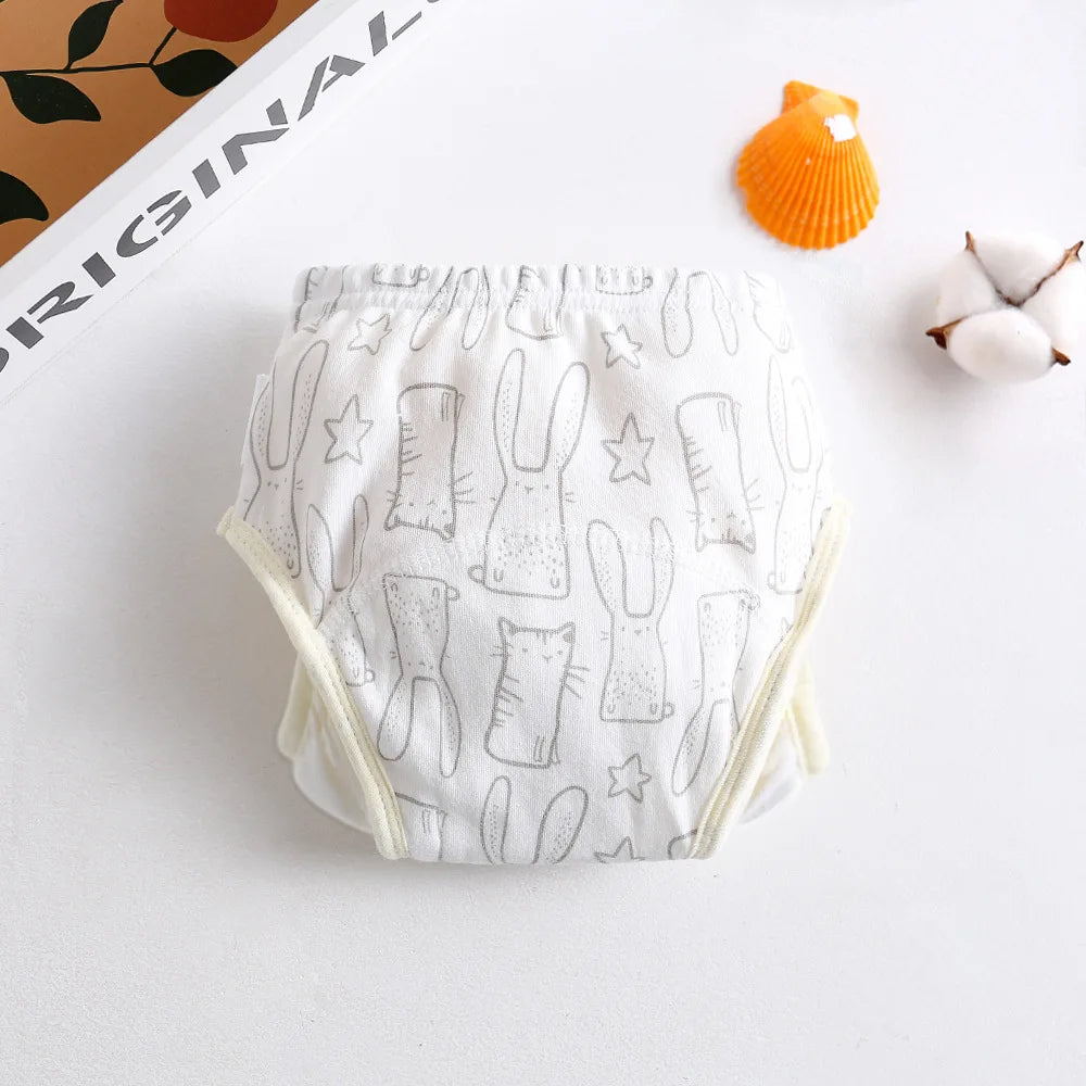 Baby care cloth diaper training pants featuring cute bunny and star print on soft white fabric.