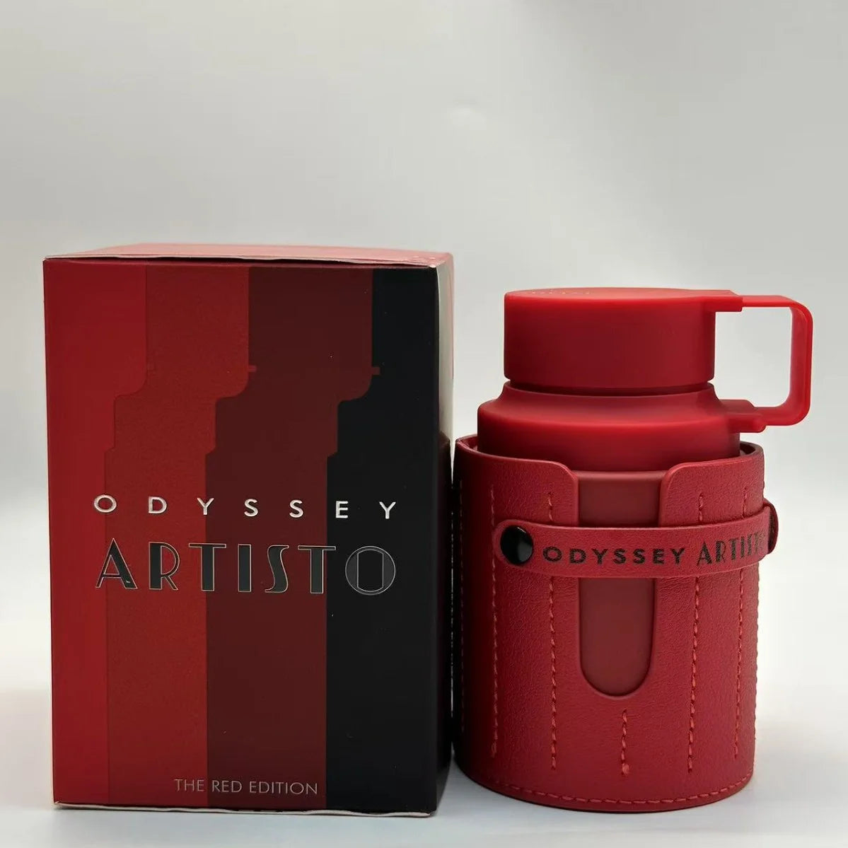 Armaf Odyssey Artisto Red Edition 100ml men's cologne, a leather-cased Middle Eastern fragrance spray.