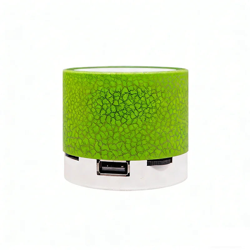Portable wireless Bluetooth speaker, green cylinder with USB port and strap control area