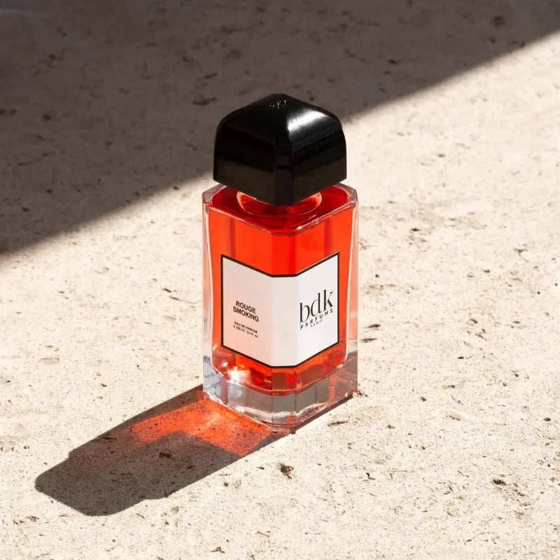 BDK Parfums Rouge Smoking 100ml EDP: Luxury unisex niche perfume, red glass rectangular bottle with black square cap.