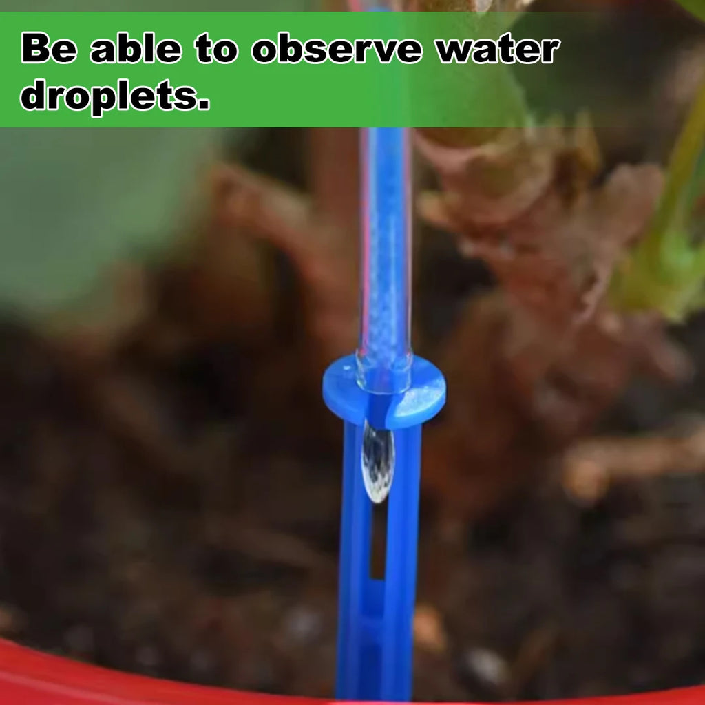 Blue drip outlet tube with visible water droplet for automatic watering system