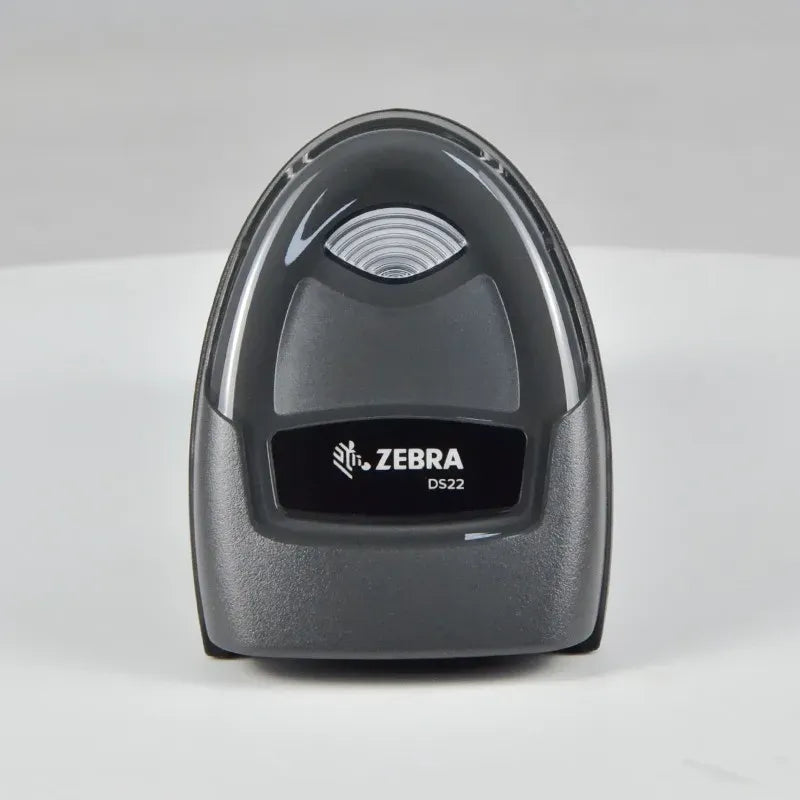 Zebra DS2208 2D wired handheld barcode scanner, front view of scan lens and cradle