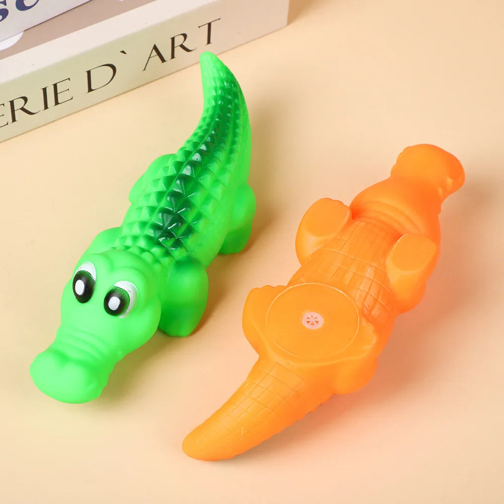 Durable green and orange squeaky rubber crocodile dog toys for interactive play and chewing fun.