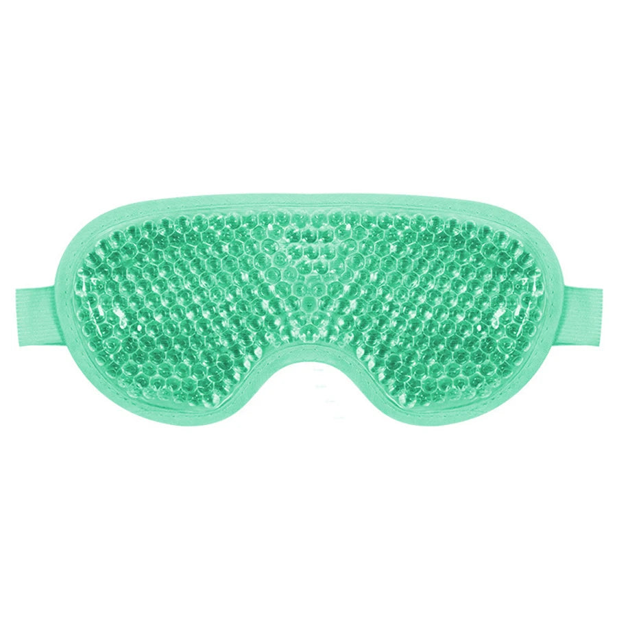 Mint green gel bead eye mask with an elastic strap for hot or cold therapy on a white background.