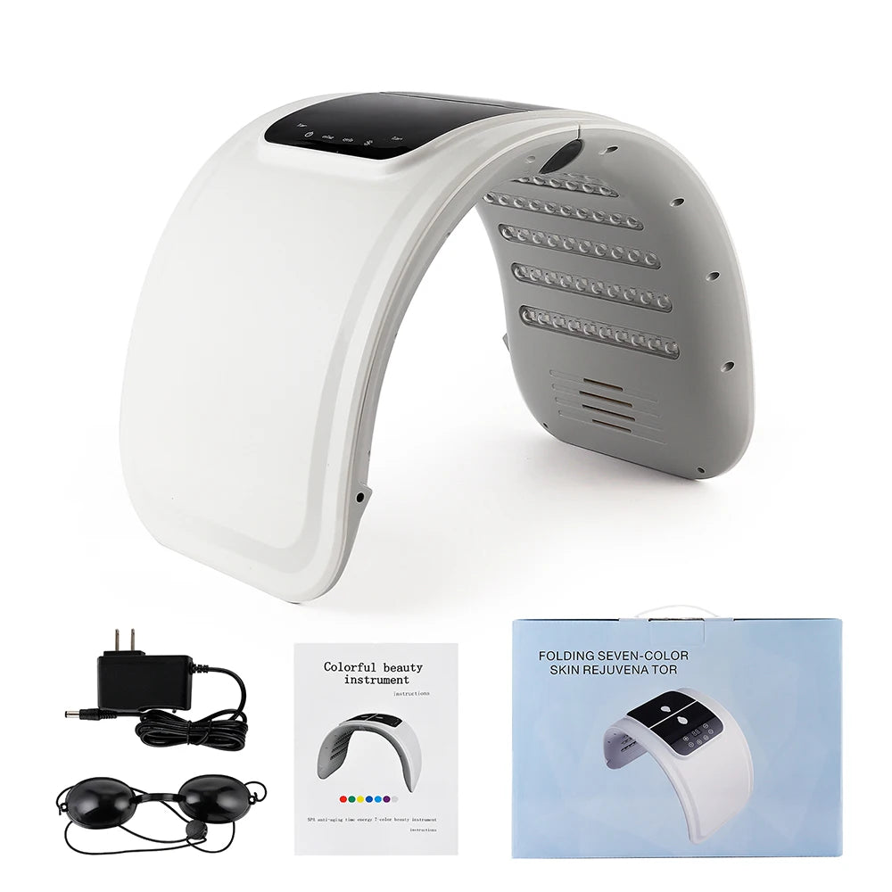 White arch-shaped LED therapy machine with lights inside, includes power cord, eye goggles, manual, and branded box.