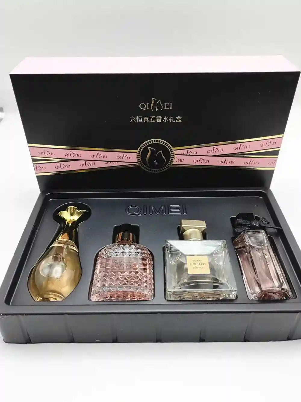 Qimei luxury women's EDP perfume 4-piece gift set: floral fruity scent, varied designer glass bottles in display box.