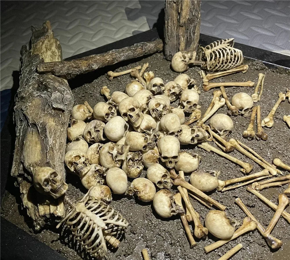 Miniature faux skeleton model for reptile terrarium or aquarium decor, realistic beige bone heap for pet habitat styling.