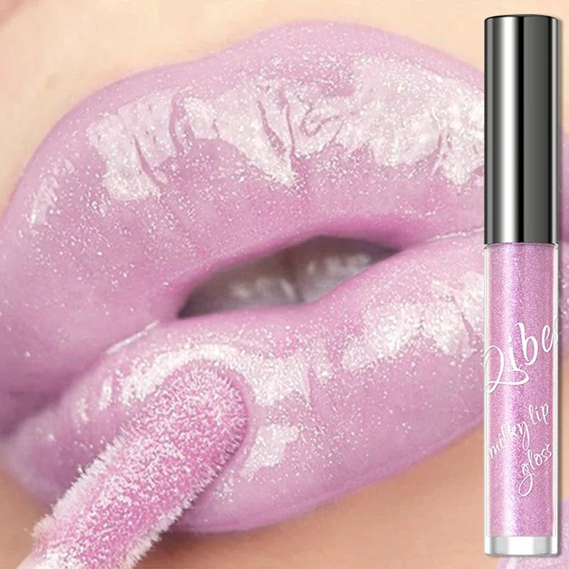 Shimmering taro purple lip gloss with gold sparkle for a moisturizing, glassy jelly shine finish on lips.