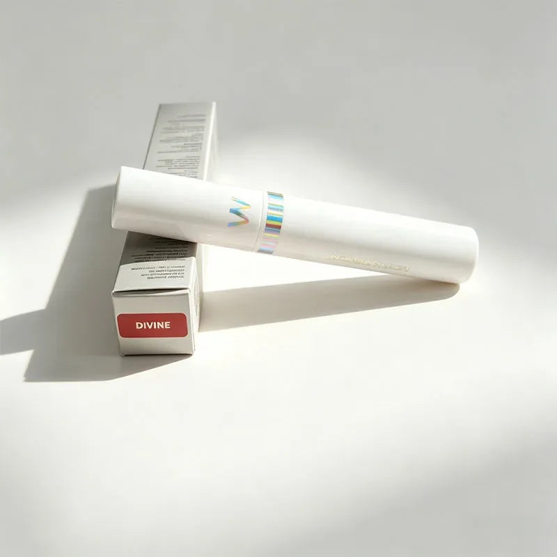 Wonderskin Divine peel-off tattoo lip stain and applicator on white background, long-lasting matte lip tint packaging.