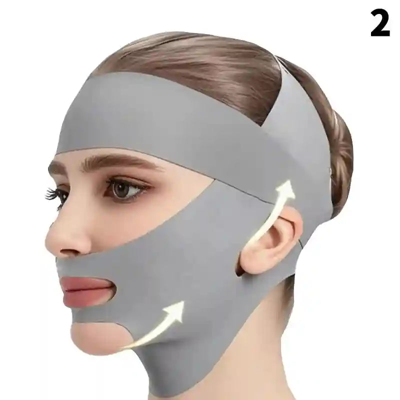 A person wears a gray, elastic V-line lifting strap that wraps around the chin and secures over the head.
