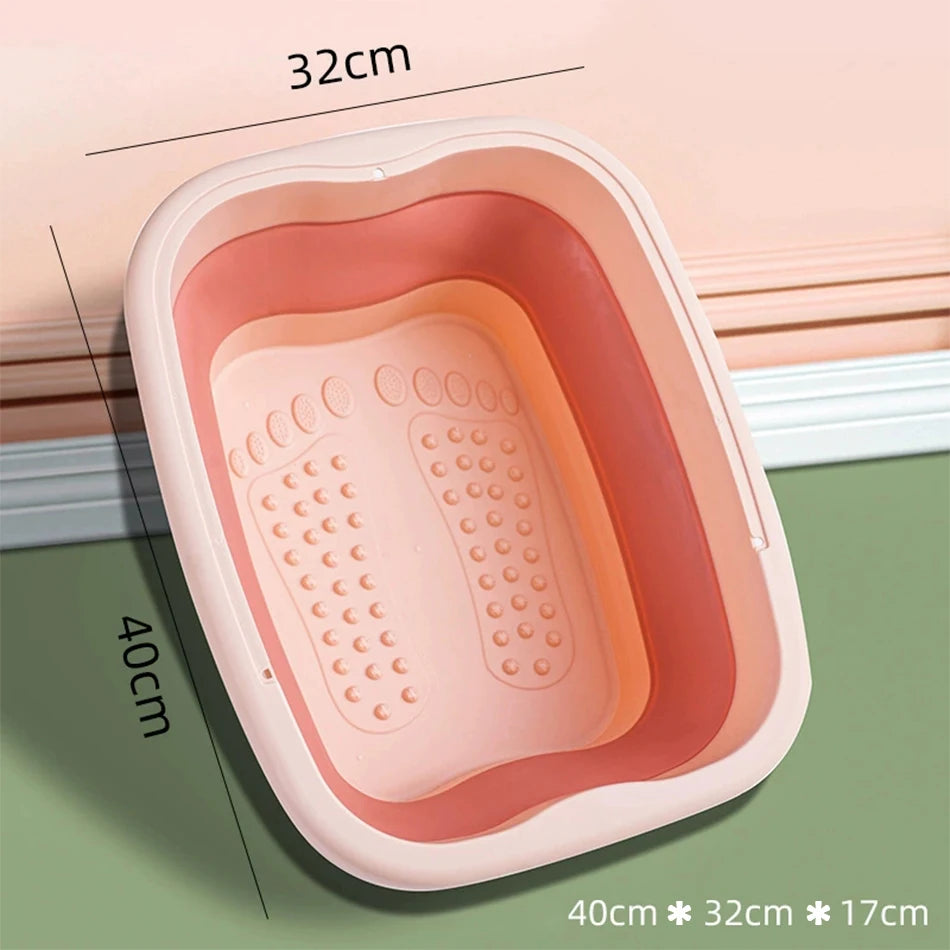 Pink foldable foot bath tub with massaging rollers, portable silicone basin for home or travel use, 40x32x17cm.
