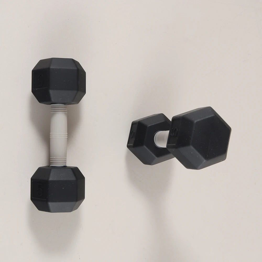 Black silicone dumbbell-shaped baby teething toy for soothing gum pain.