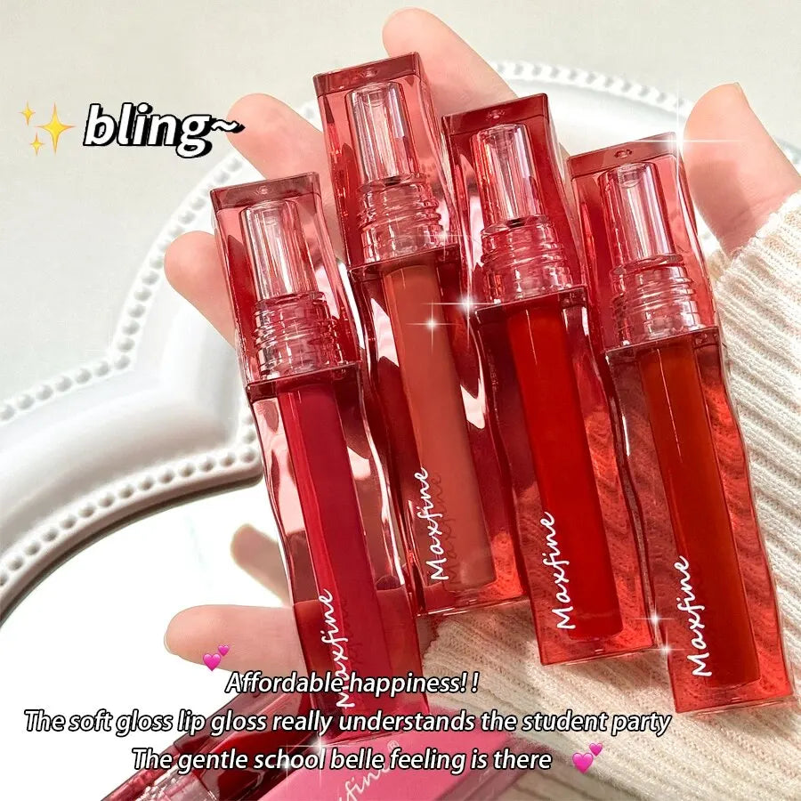 Four tubes of highly pigmented, non-stick Maxfine liquid lipstick in various glossy red and nude shades.