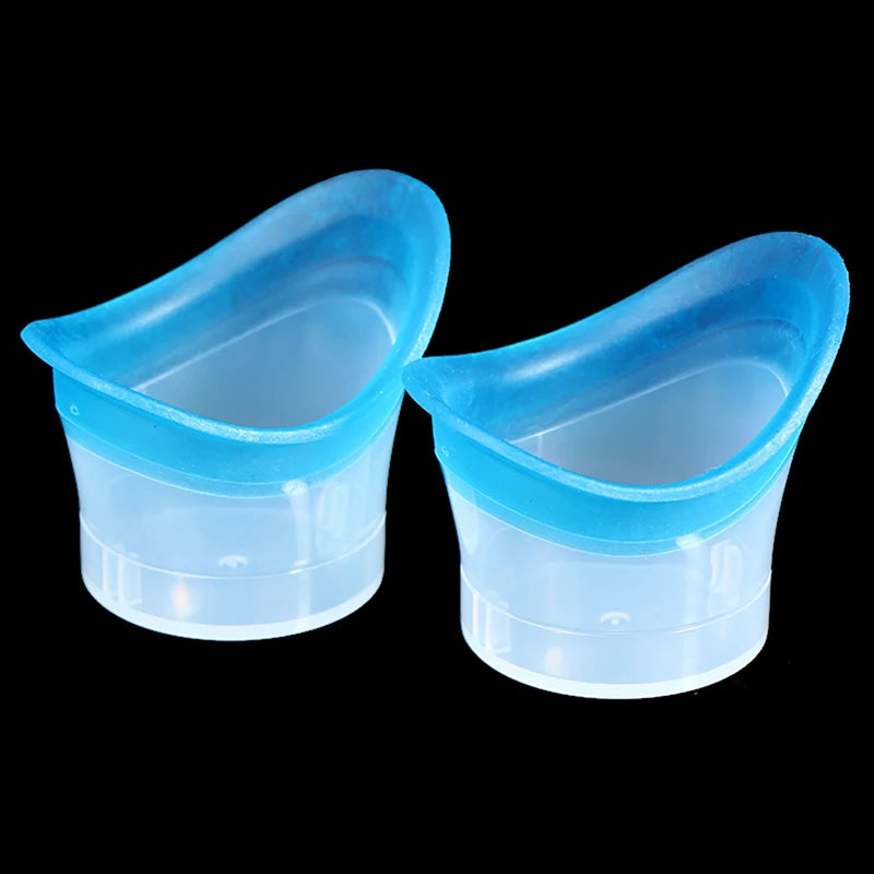Two reusable soft blue silicone eye wash cups for hygienic eye flushing and cleaning on a black background.