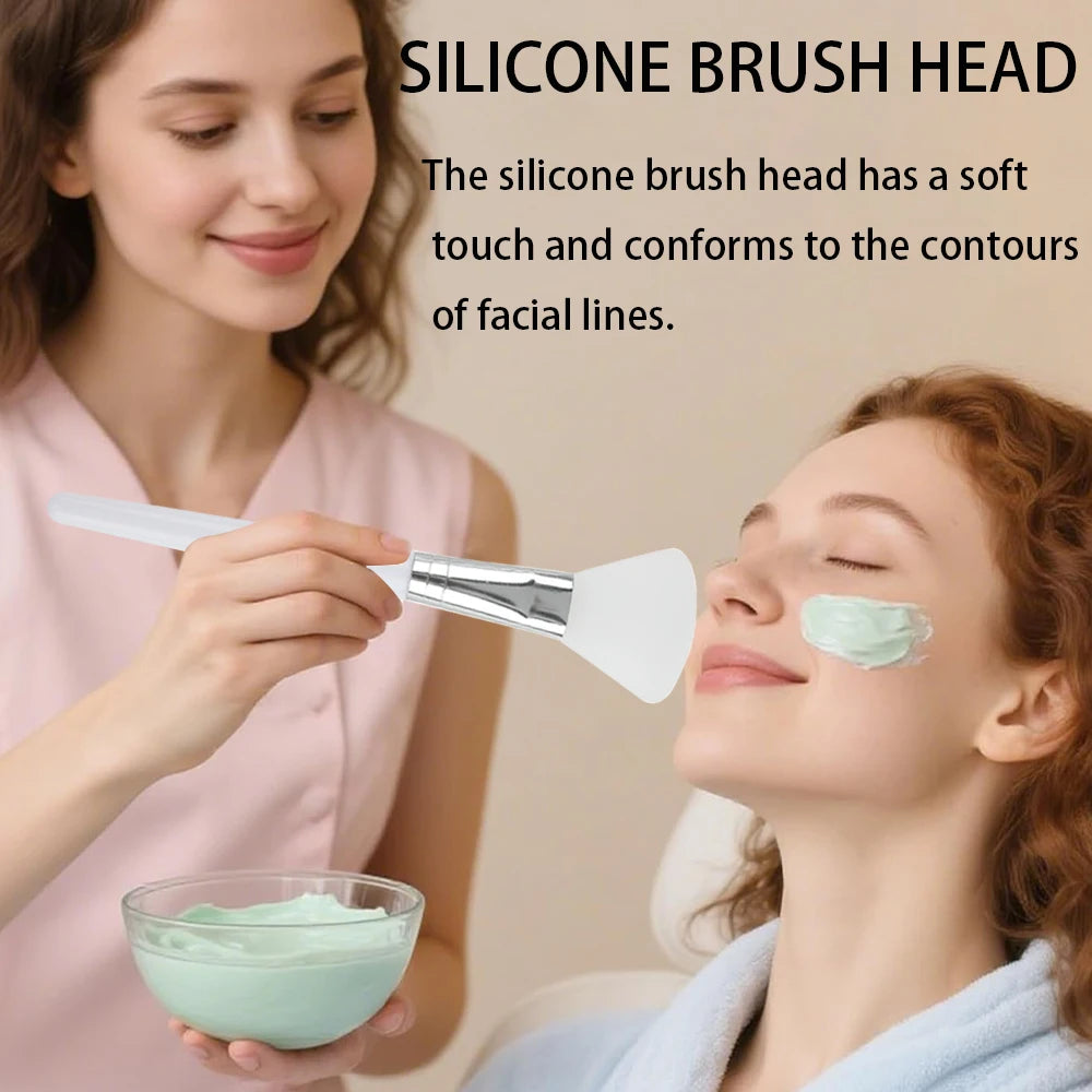 A person applying green face mask with a white, flexible silicone brush applicator.