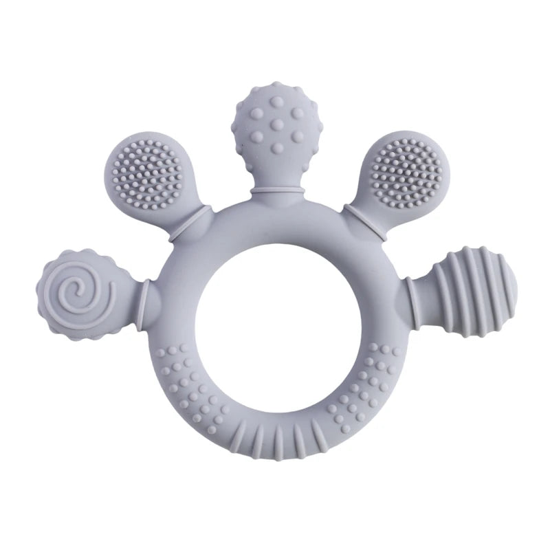 Gray silicone baby teething ring toy with textured surfaces for soothing sore gums.