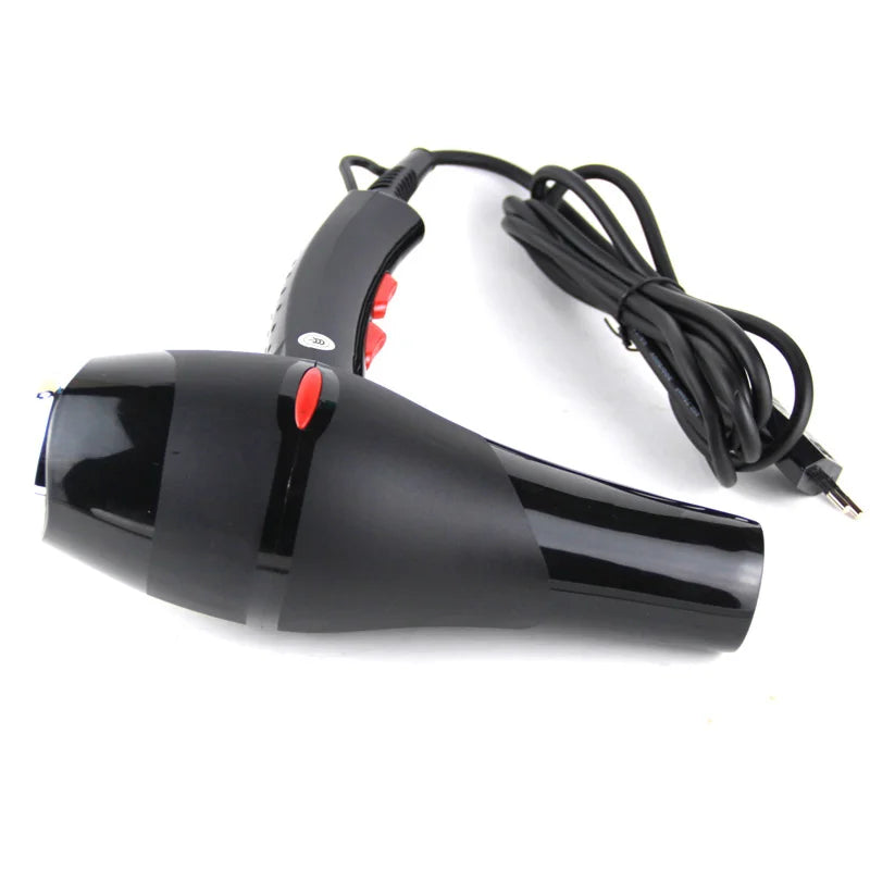 Black 2100W professional salon hair dryer with speed controls, power cord, and fast-drying nozzle attachment.