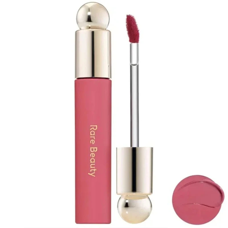 Rare Beauty Soft Pinch Tinted Lip Oil with applicator and pink berry swatch, moisturizing glossy lip makeup.