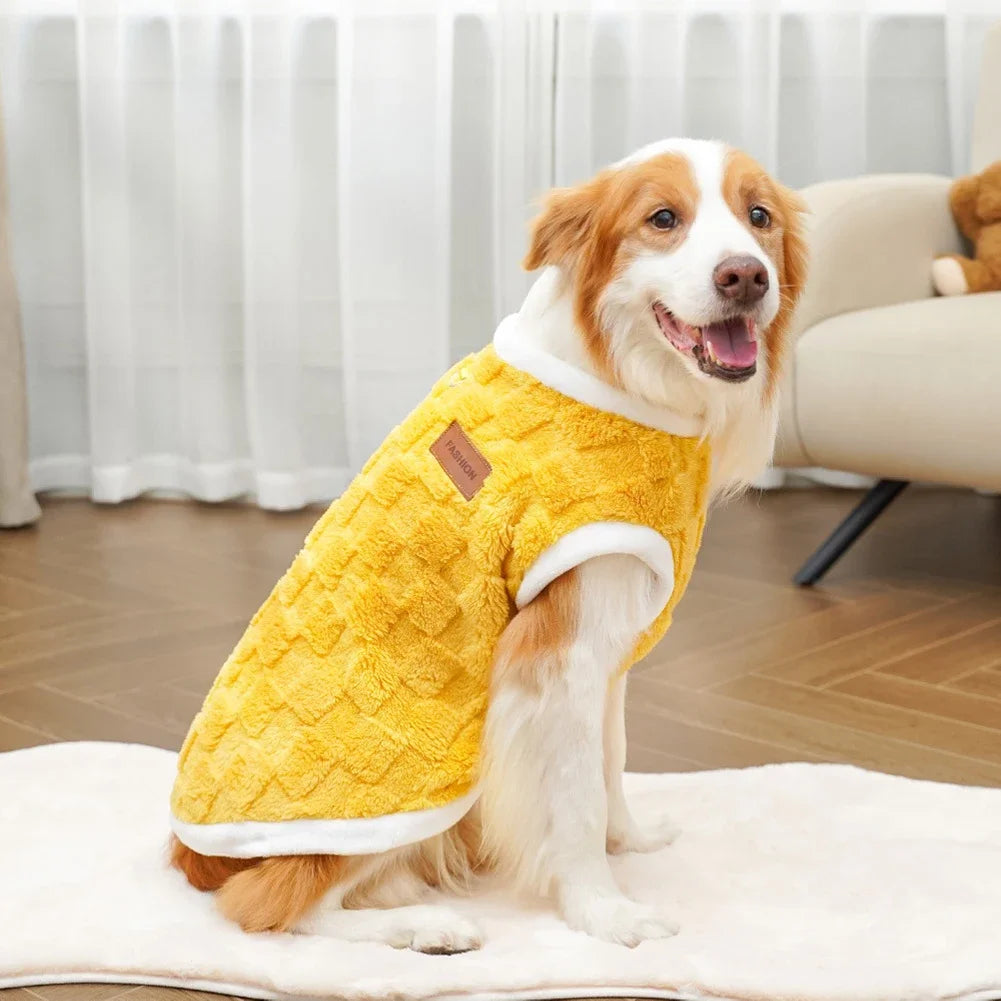 Dog wearing a cozy yellow fleece winter sweater. Warm, soft pullover vest for small to large dogs for cold weather.