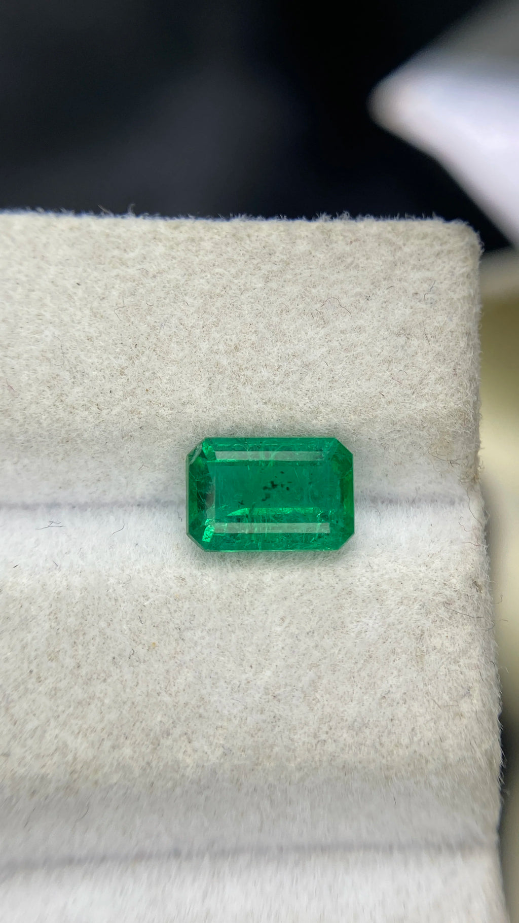 Green emerald-cut gemstone with octagon facets, loose natural stone for jewelry making.