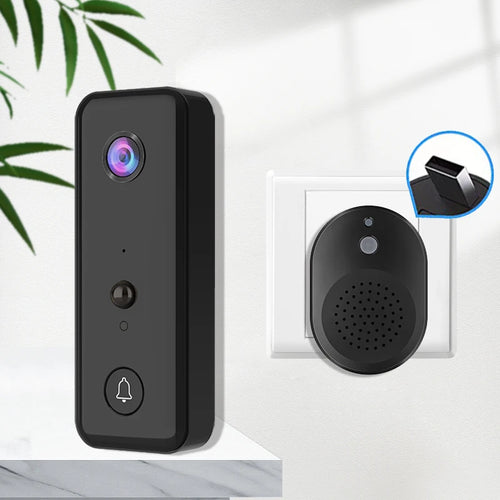 Black wireless video doorbell on wall plate with round chime receiver