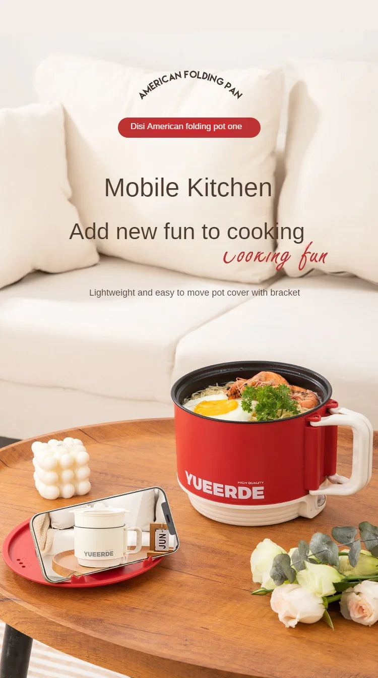 Red electric folding pot cooker on tabletop with white accessories tray, YUEERDE logo