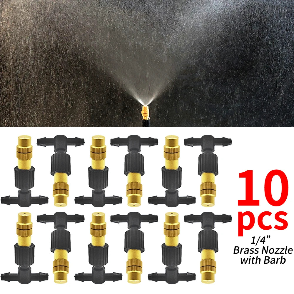 Brass misting nozzle set with black tees and barbed ends, spray pattern visible