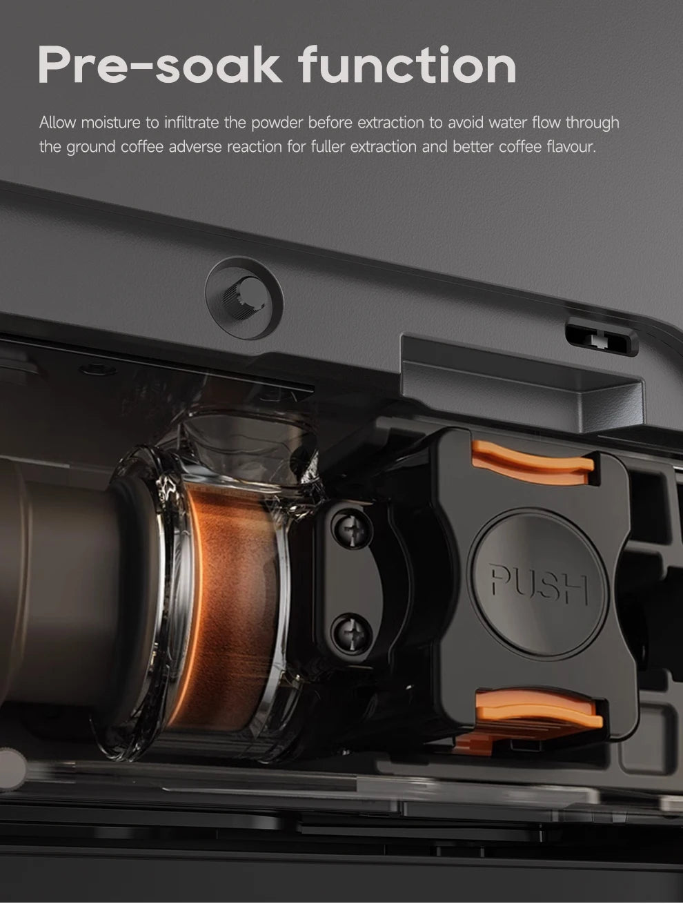 Black coffee machine internal mechanism with a clear chamber, ground coffee, and a Push release button.