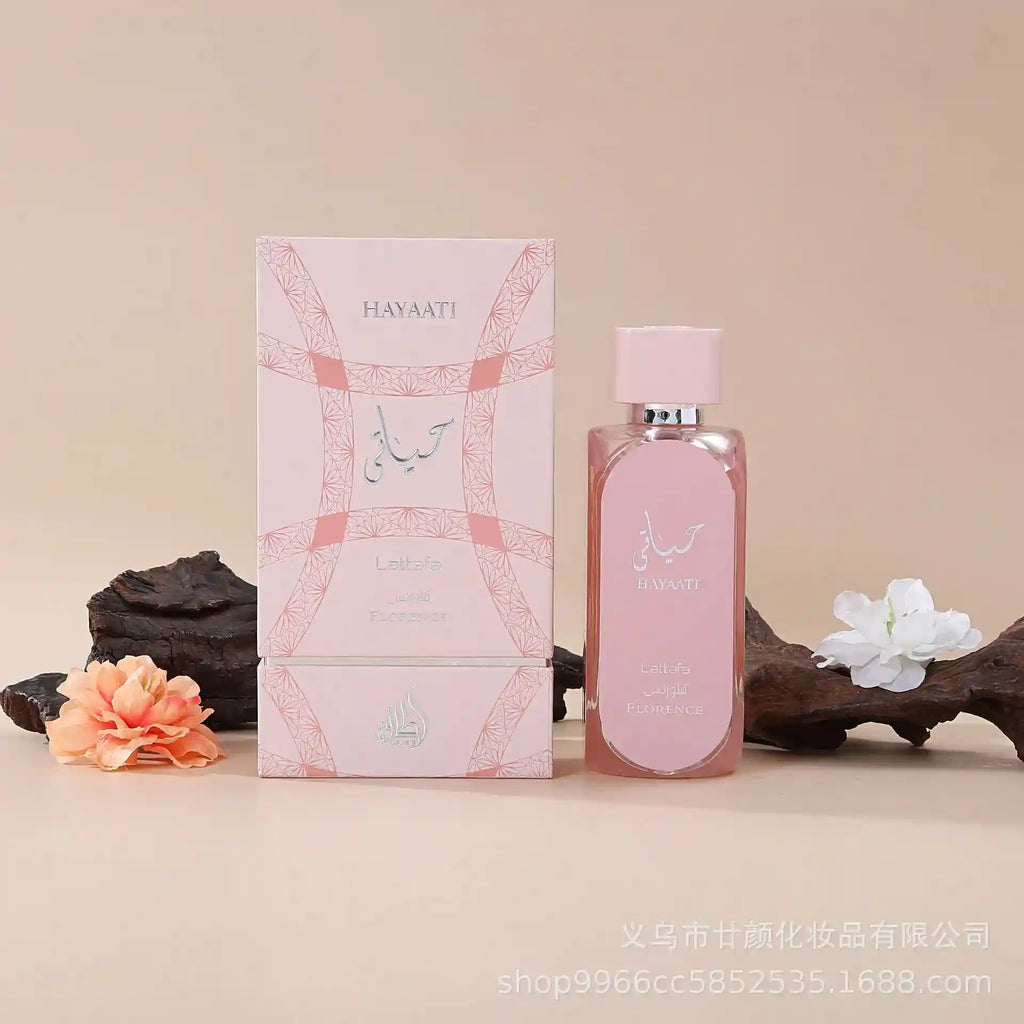 Hayaati Florence perfume in a pale pink rectangular glass bottle and matching box with intricate geometric patterns.