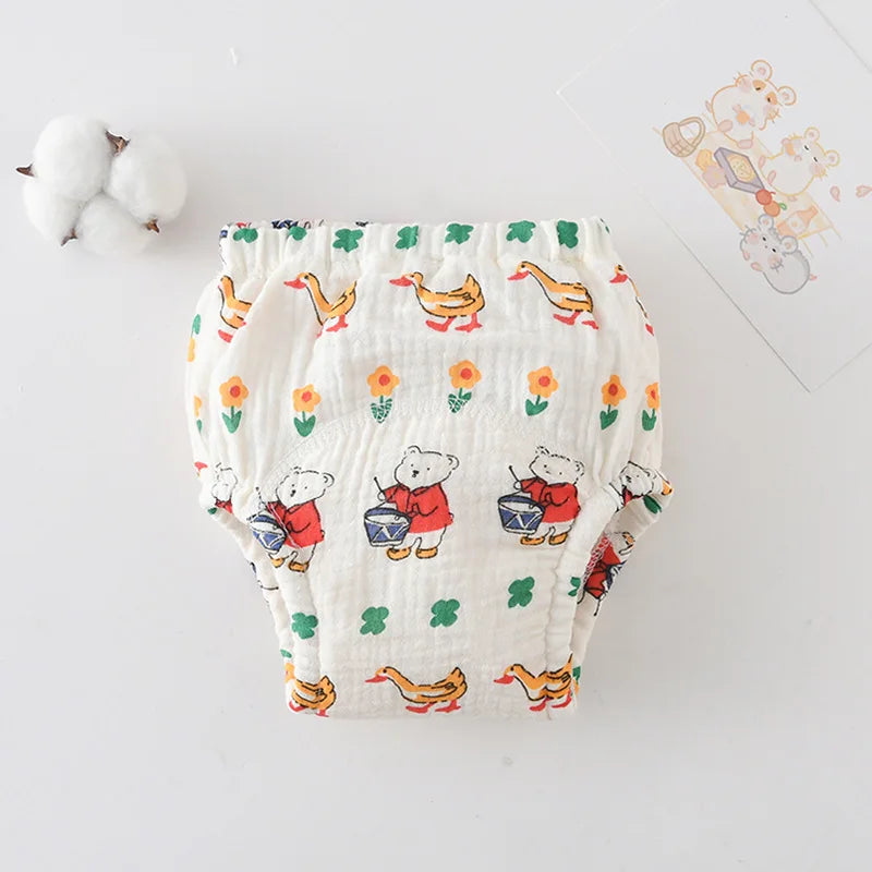 Baby care cotton training diaper with cute bear and duck pattern on white background for toddlers.